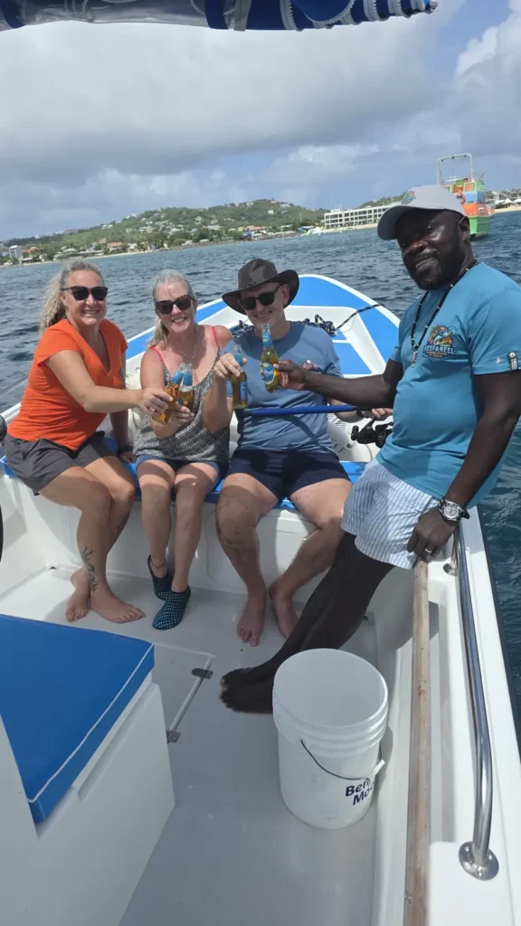 Guests and crew smiling on board with the morning's catch